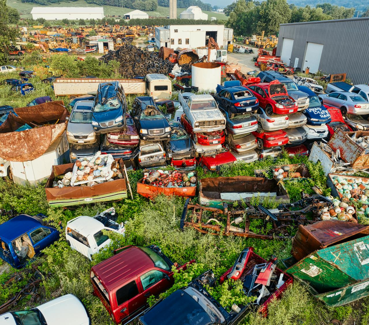Services Aerial photograph of a recycling yard filled with old cars and parts, Saint Charles, Minnesota.
